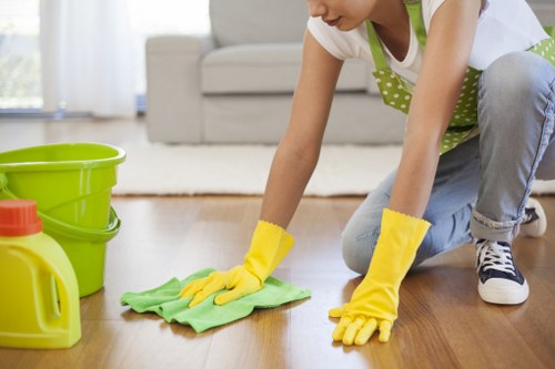 Reliable office cleaners in N19 disinfecting a modern workplace